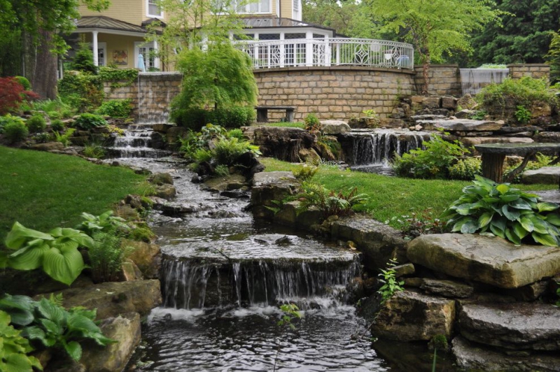 paysagiste-LA ROCHETTE-min_landscaping-rock-louisville-ky-traditional-landscape-and-boulders-brick-wall-bushes-grass-koi-law